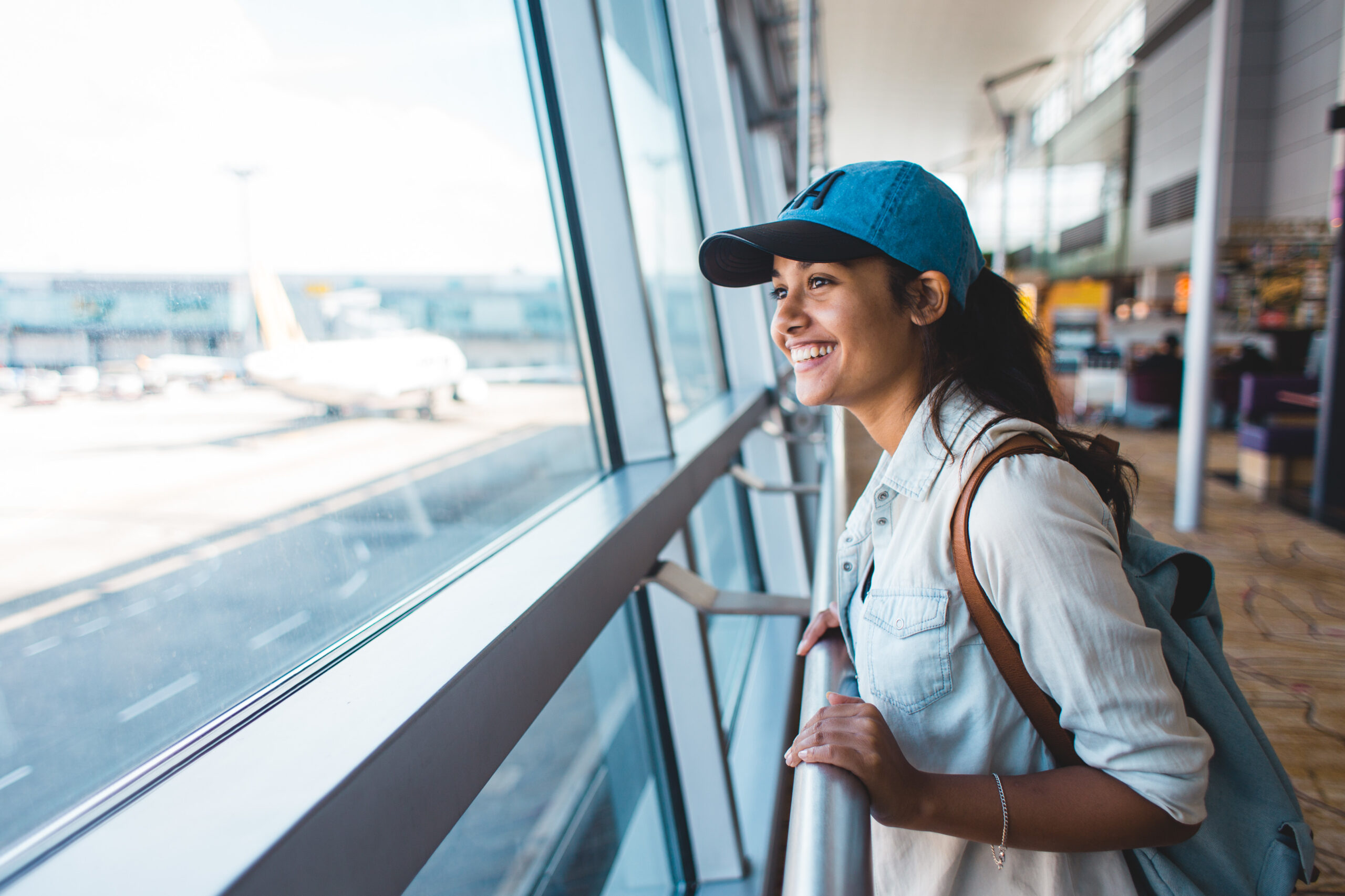 young-woman-excited-and-waiting-her-trip-at-the-ai-2023-11-27-05-26-35-utc